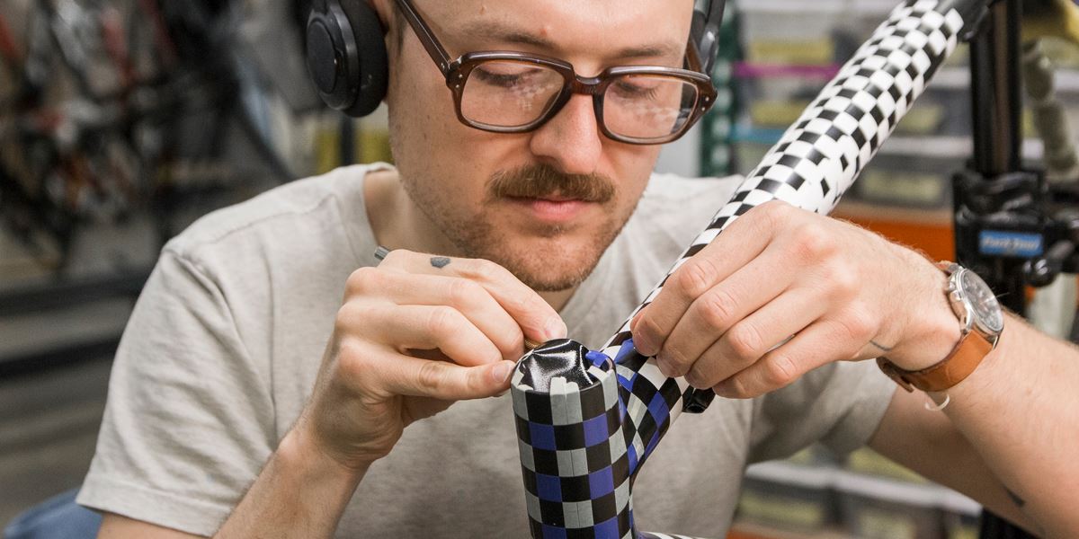 Ruckus lead painter masks a frame that will be painted